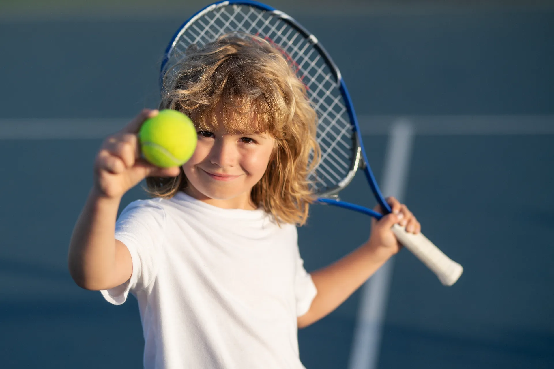 child playing tennis outdoor court child with tennis ball sport child with racket tennis playg